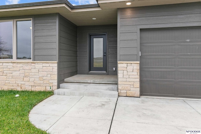 entrance to property featuring a garage