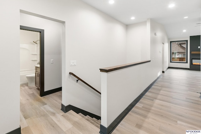 hallway with light hardwood / wood-style flooring