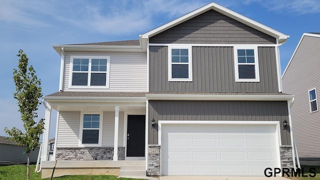 craftsman inspired home with a garage and a porch