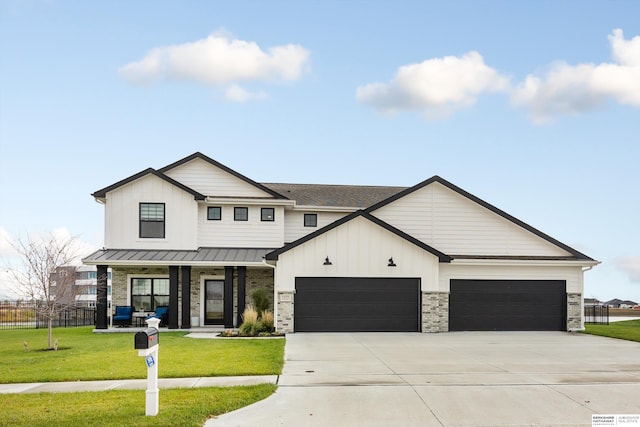 modern farmhouse with a front yard and a garage