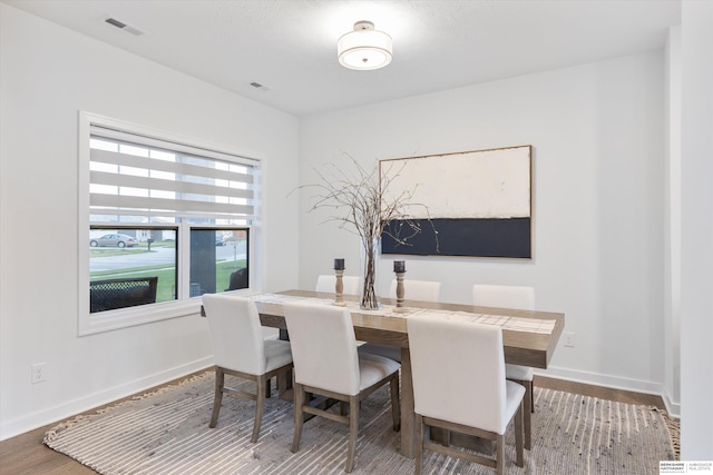 dining space featuring hardwood / wood-style floors