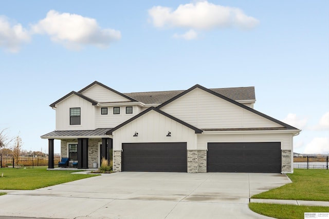 modern farmhouse featuring a garage and a front yard