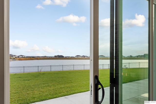 doorway to outside with a water view