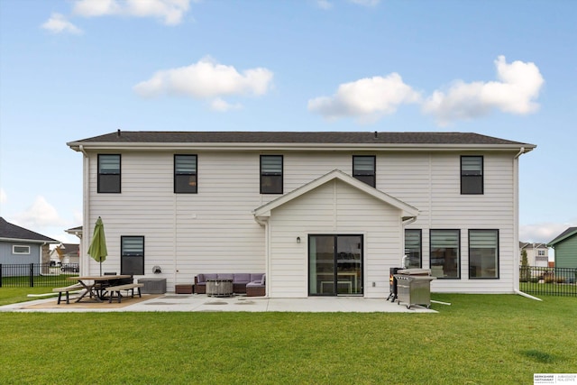 back of property featuring outdoor lounge area, a lawn, and a patio area