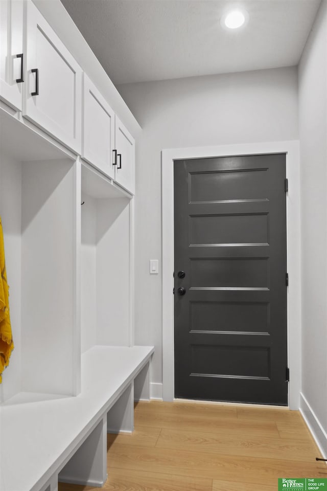 mudroom with light hardwood / wood-style flooring