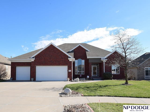 view of front of property with a front lawn and a garage