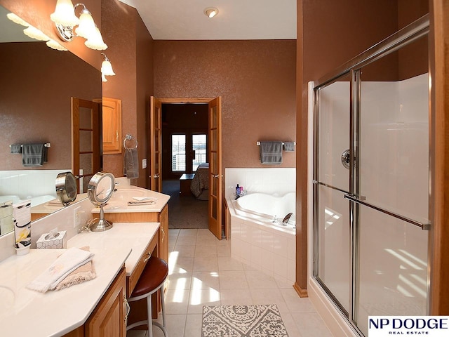 bathroom with vanity, tile patterned floors, and independent shower and bath