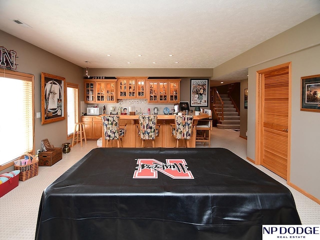 playroom featuring bar area, light carpet, and pool table