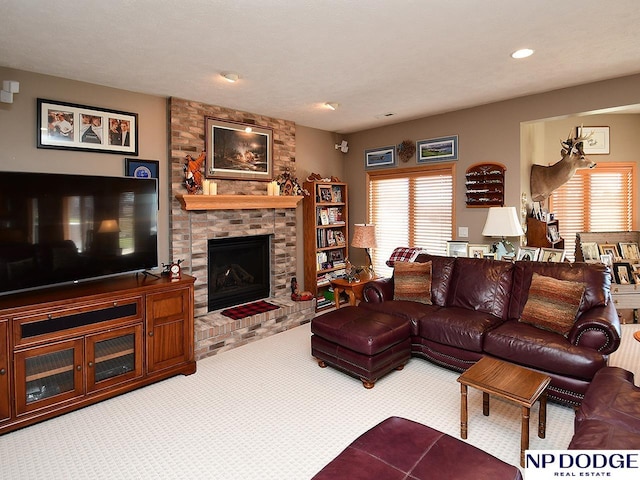 carpeted living room featuring a brick fireplace