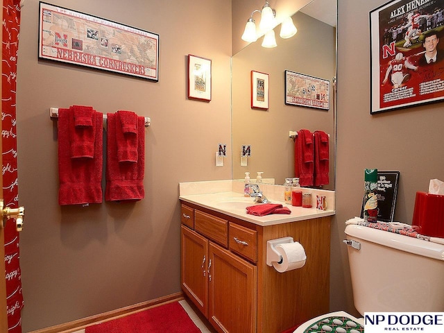 bathroom featuring vanity and toilet