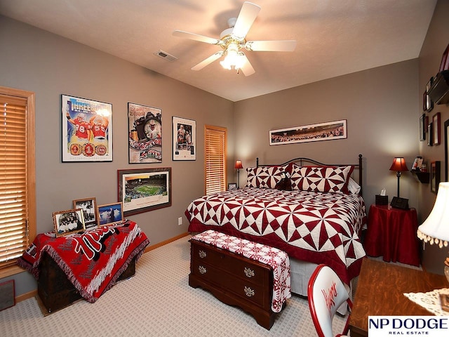 bedroom with light colored carpet and ceiling fan