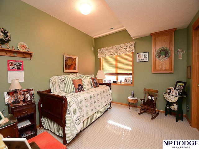 carpeted bedroom with a textured ceiling