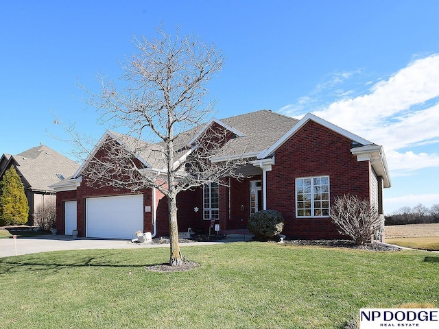 view of front of property featuring a garage and a front yard