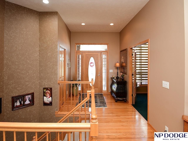 foyer entrance with wood-type flooring