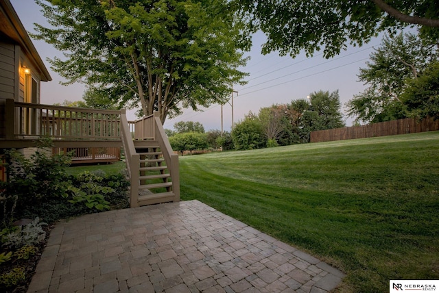 view of yard with a patio area and a wooden deck