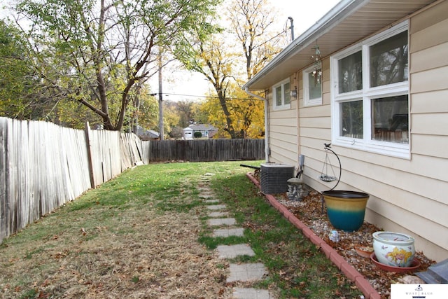 view of yard with central AC