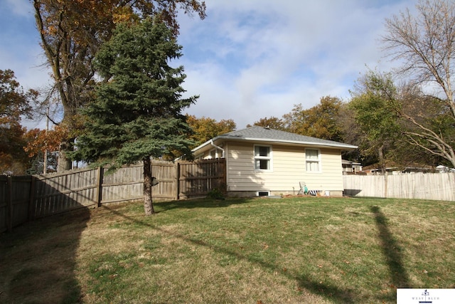 rear view of house with a yard