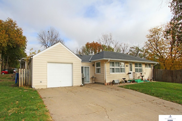 single story home featuring a garage and a front yard