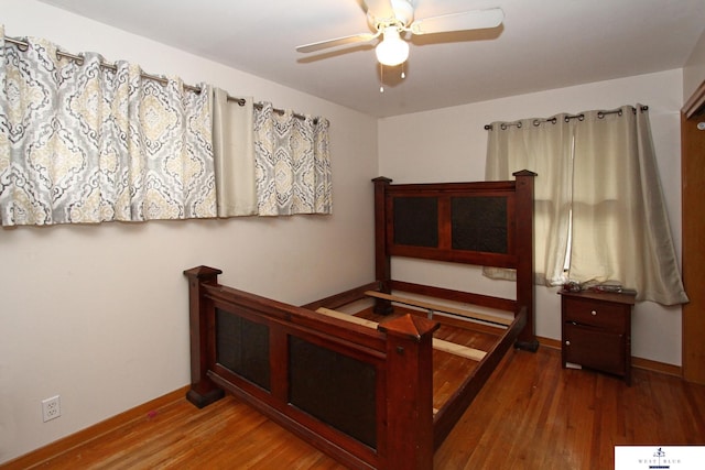 bedroom featuring hardwood / wood-style floors and ceiling fan