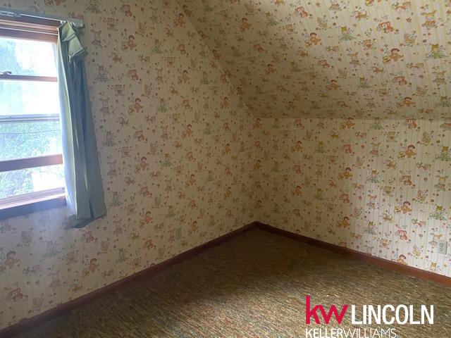 unfurnished room featuring hardwood / wood-style flooring