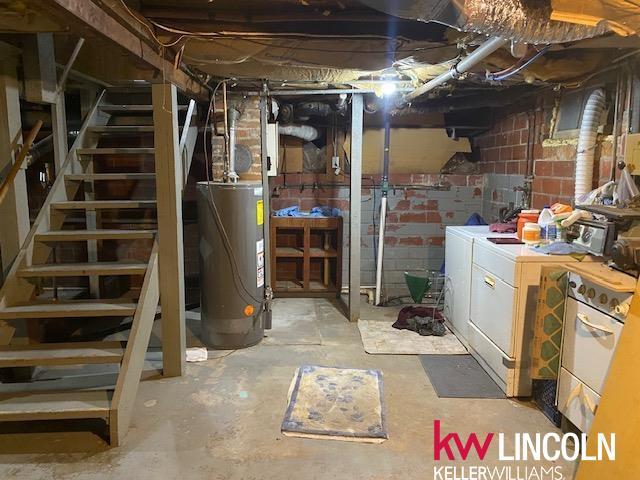 basement with separate washer and dryer and gas water heater