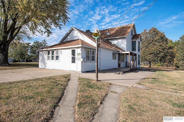 view of home's exterior featuring a yard