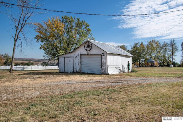 garage with a yard