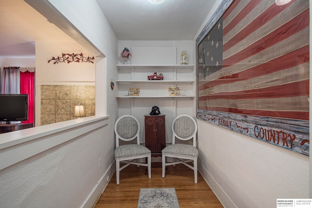 living area featuring hardwood / wood-style floors