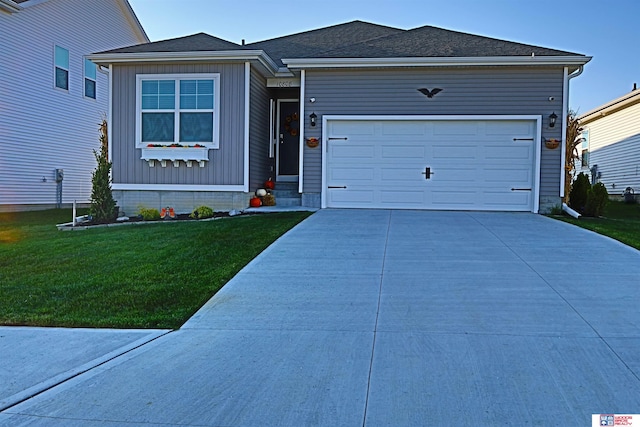 view of front of property featuring a garage and a front yard