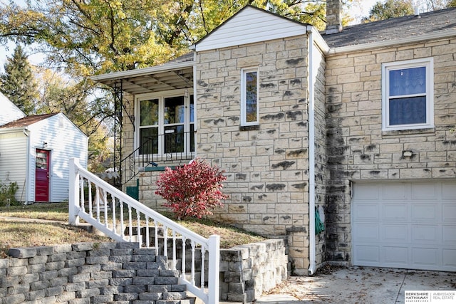 view of side of home with a garage