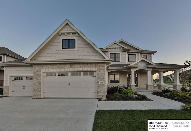 view of front of home with a garage and covered porch