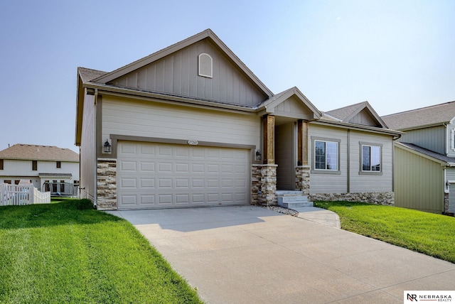 view of front of home featuring a garage and a front yard