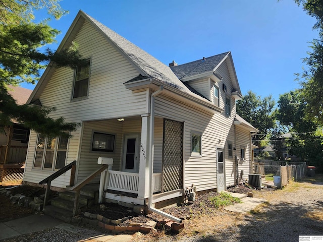 view of front of home with central AC and covered porch