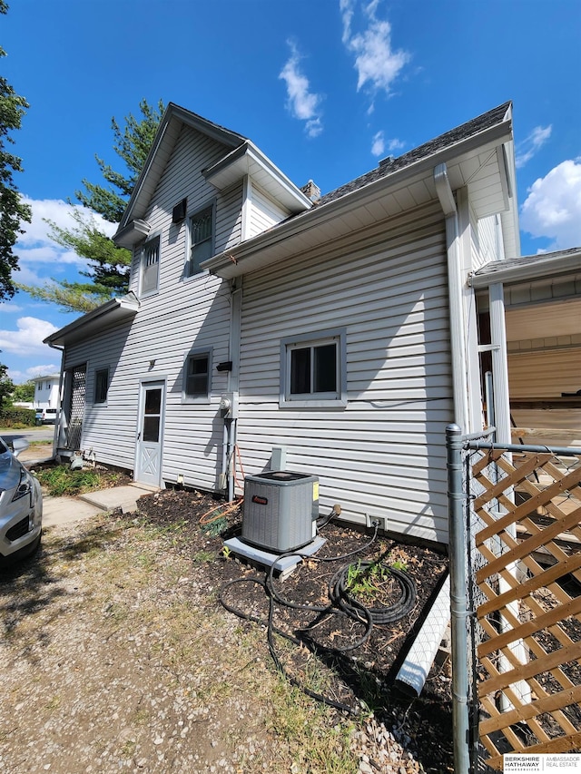 view of side of home featuring central air condition unit