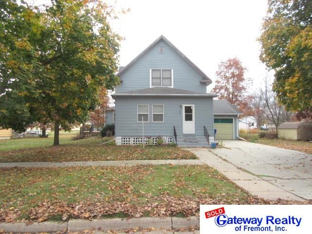 back of house with a garage