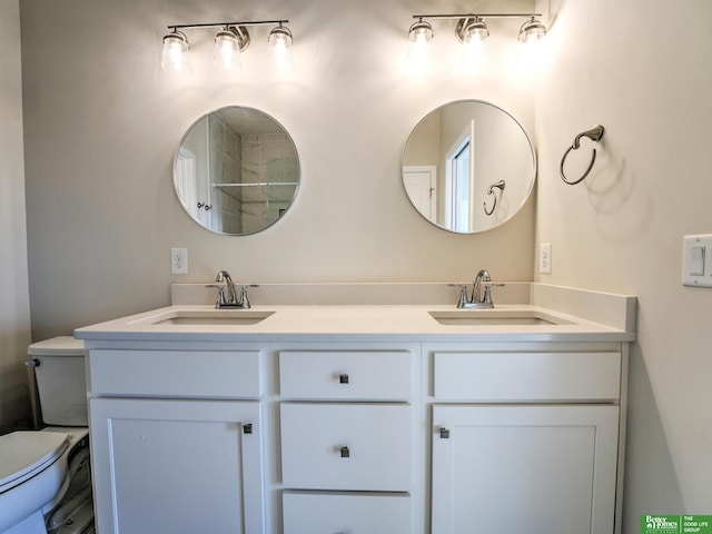 bathroom with vanity and toilet