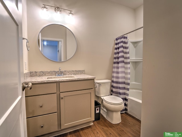 full bathroom featuring toilet, shower / bath combo, vanity, and hardwood / wood-style flooring