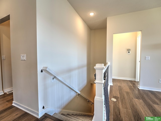 stairway with wood-type flooring