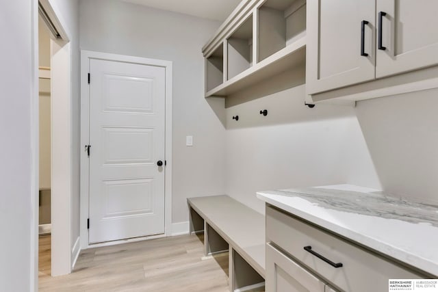 mudroom with light hardwood / wood-style flooring