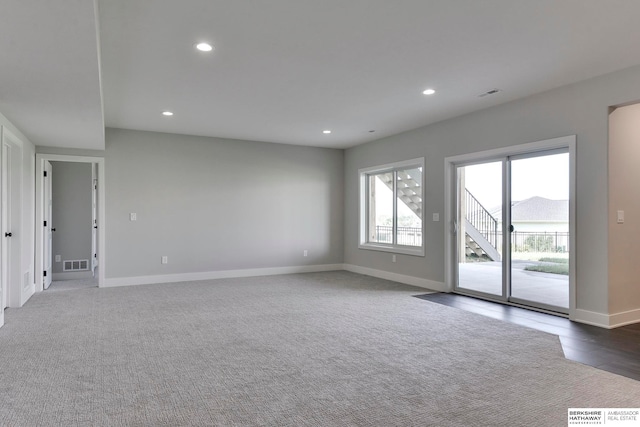 spare room featuring dark hardwood / wood-style flooring