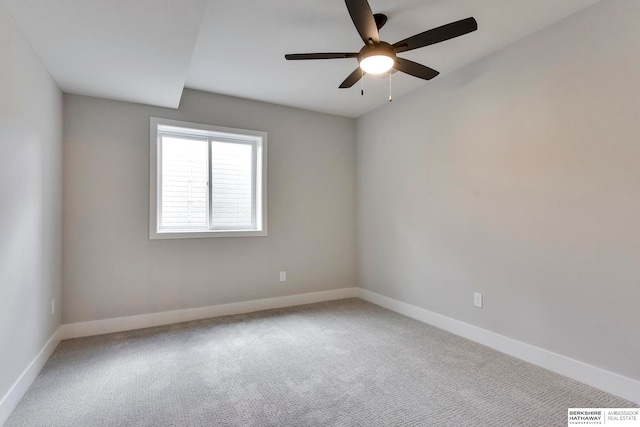 spare room featuring ceiling fan and carpet floors