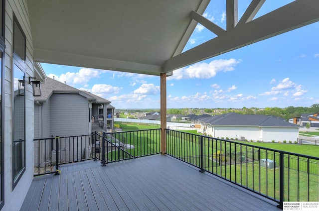 wooden deck with a lawn