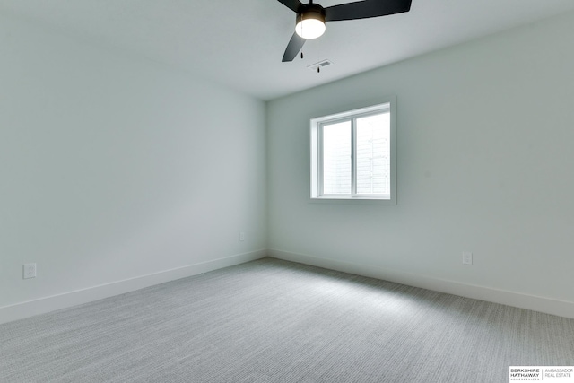 unfurnished room with light carpet and ceiling fan