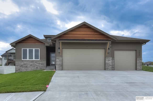 view of front of property with a front lawn and a garage