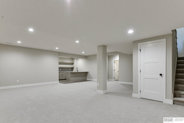 basement with light colored carpet