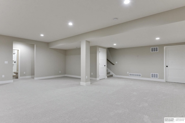 basement with light colored carpet