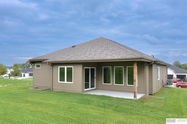 back of property featuring a yard and a patio