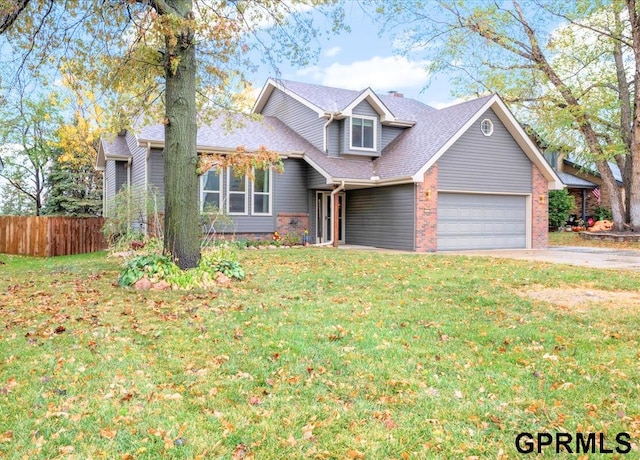 view of front of house with a garage and a front yard