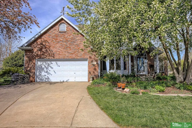 view of front of house featuring a garage and a front yard