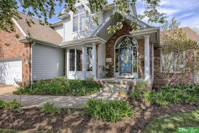 doorway to property featuring a garage